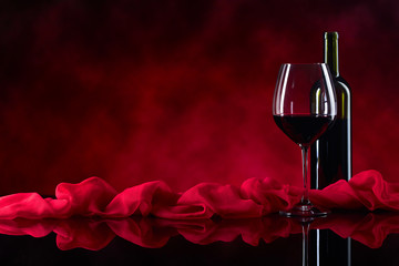 Glass and bottle of red wine. © Igor Normann