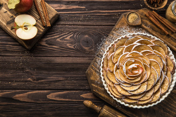 sweet autumn apple tart on wooden background