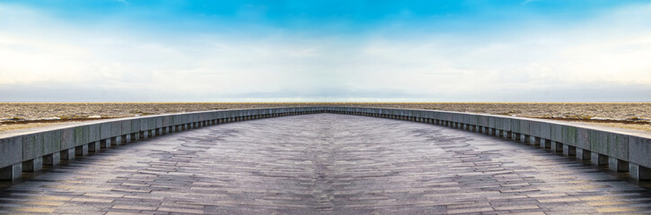 Semicircular embankment overlooking the horizon bay in the storm.