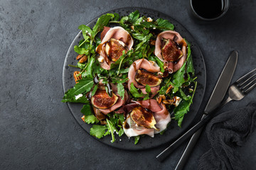 prosciutto, figs, arugula, goat cheese salad with pecan nuts and balsamic sauce