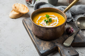 homemade pumpkin soup with cream and pumpkin seeds