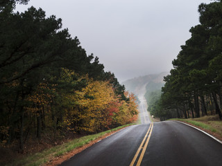 Scenic mountain highway with fog or mist