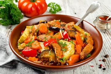 Meat stew with with eggplant, carrots, onions, peppers and zucchini