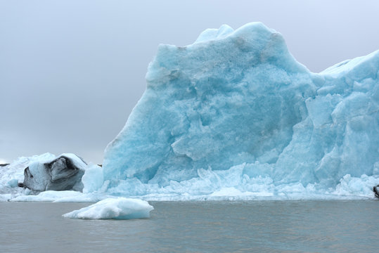 Blue iceberg in water of Iceland lagoon