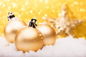 Christmas composition of Christmas tree toys on a gold background