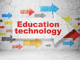 Education concept:  arrow with Education Technology on grunge textured concrete wall background, 3D rendering