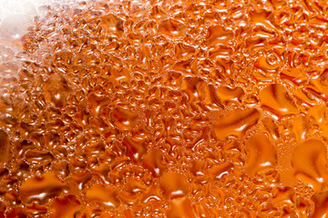 abstract background of drops on a red glass