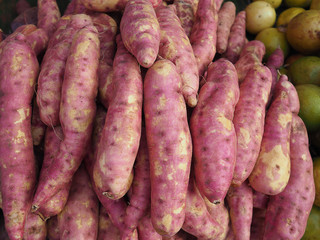 Fresh purple yams pile sale on the market.
