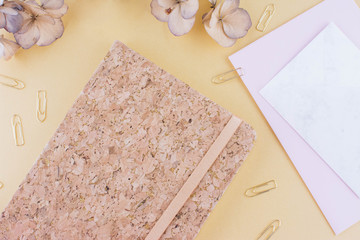 Top view image of notebook with with pen.