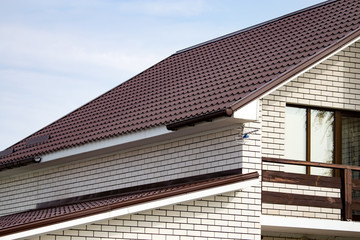 roof of a cottage house against a blue sky