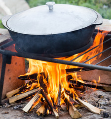 cooking in a cauldron at the stake