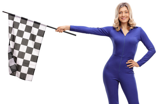 Attractive woman in a blue racing suit holding a checkered race flag