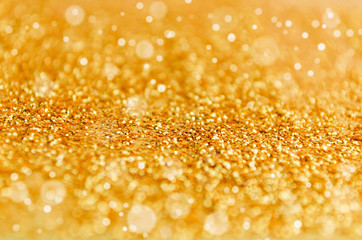 golden glitter texture and bokeh light ,christmas and new year festival holiday abstract background, copy space, high contrast color tone