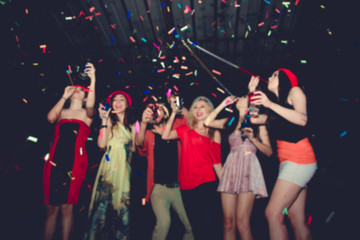 Blurred People in Party - Group of Friends Enjoy Throwing Confetti and Dancing in Nightclub