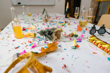 Confetti and champagne all over conference room table