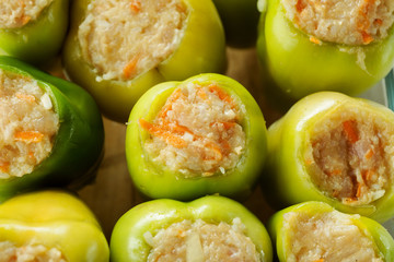 Fresh green bell peppers stuffed with meat with rice top view