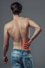 Naklejka premium Handsome man on grey background