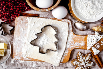 cooking christmas gingerbread on wooden background top view