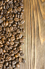 Coffee beans on wooden background