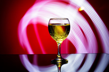  glass of champagne on  red background. 