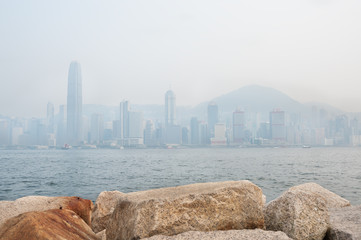 The skyscrapers of Hong Kong's financial district and Victoria Peak obscured by air pollution