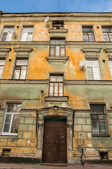 Front door of old building, constructed in 1903 in Vyborg, Russia. Inscriptions on the wall from Russian are 