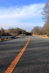 Way following a blue sky