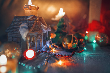 Christmas decorations, burning candles, garlands, lights