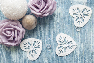 Christmas winter roses on wooden blue background on a happy sunny day