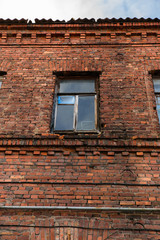 Facade of old red brick building in Vyborg, Russia