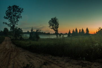 Obraz na płótnie Canvas Morning fog and sunset