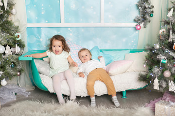 Obraz na płótnie Canvas Children in a Christmas decorations