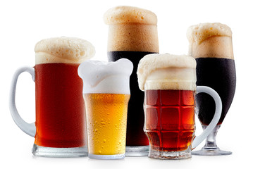 Mug collection of frosty dark red and light beer with foam isolated on a white background