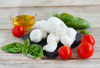 Italian cheese mozzarella nodini with tomatoes and herbs