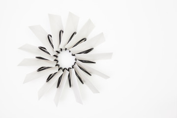 Obraz premium Propeller of white envelopes on the white table