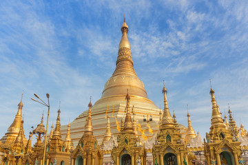 view of  Shwedagon big golden pagoda most sacred Buddhist pagoda in rangoon, Myanmar(Burma) on blue sky background 