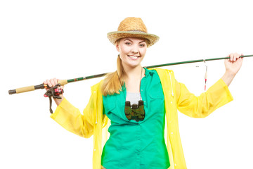 Woman with fishing rod, spinning equipment