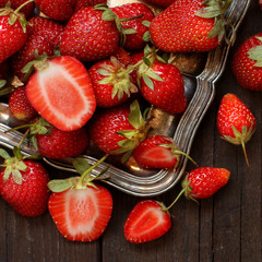 Strawberries  on a tray on a wooden table