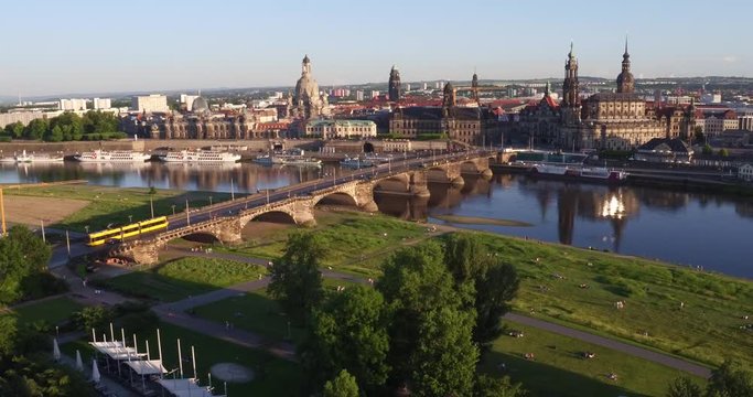 aerial drone moving up at a building to cityscape dresden germany sunrise sunset 4k