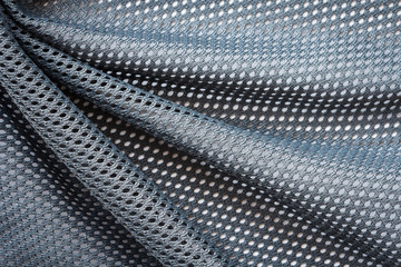 wrinkled gray mesh sport fabric with large diagonal folds