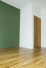 Empty room with wooden door