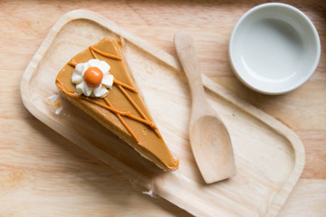 Thai tea cake with small wooden spoon