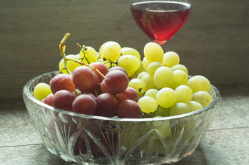 wine and colorful grapes