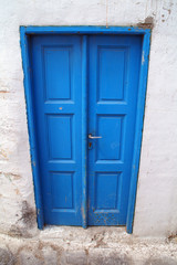 Fototapeta na wymiar Greece, Cyclades islands, Mykonos, old house, blue door.