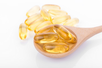 Fish oil pill on white background