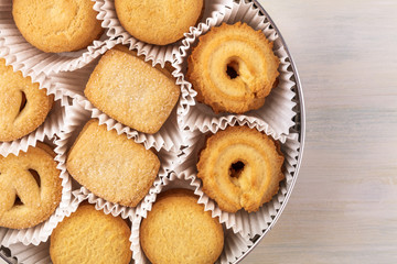 Closeup of Danish butter cookies in tin with copyspace