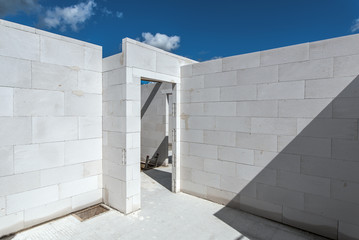 View to the upper floor of a residential building. A detached house is built in solid construction. Free view of the sky