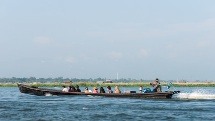 The wooden long boat as a taxi for Intha people using for travel around the village in the Inle Lake and to transport the goods to and from the village also for the tourists.