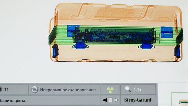 X-ray screenshot in the airport on the safety control. Airport security check scan machine with metal detector X ray