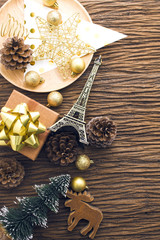 warm tone color of christmas decration prop on wood background top view